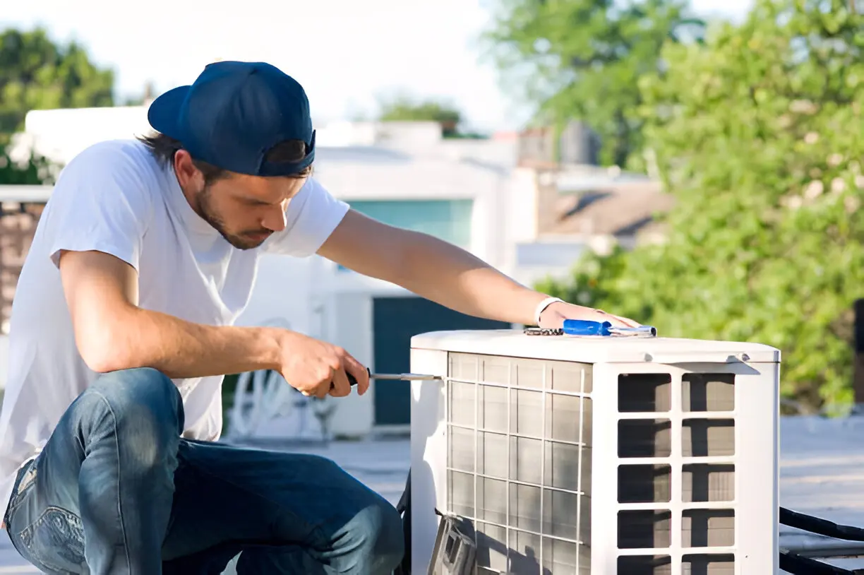 Emergency AC technician repairing unit in Plant City, FL